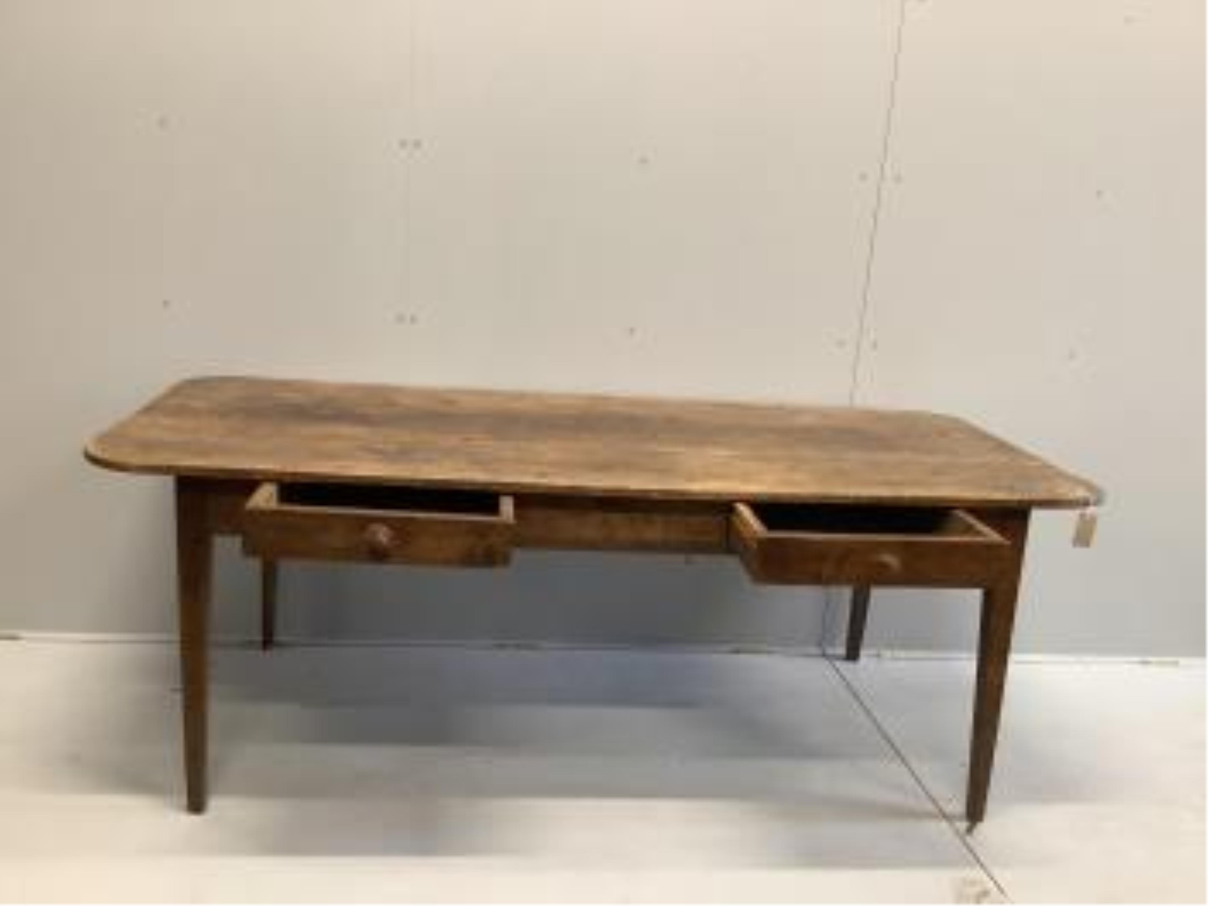 A 19th century French rectangular fruitwood kitchen table, width 200cm, depth 88cm, height 72cm. Condition - fair for age, old worming holes that have been treated